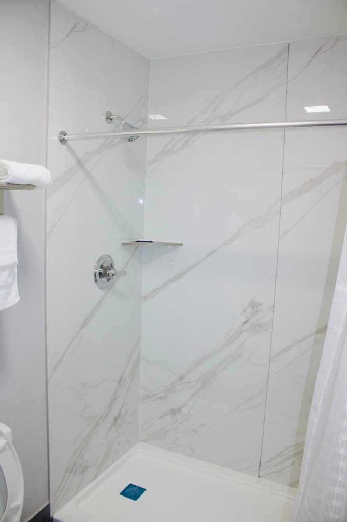 Walk-in shower with marble-look surround