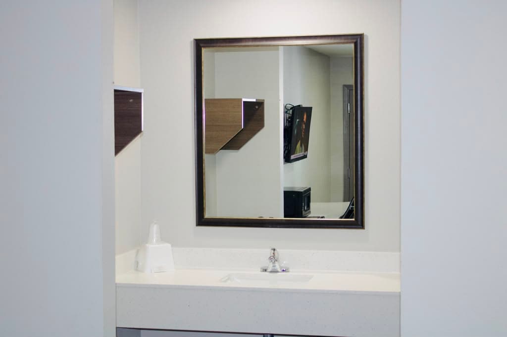 Vanity mirror and sink outside the bathroom