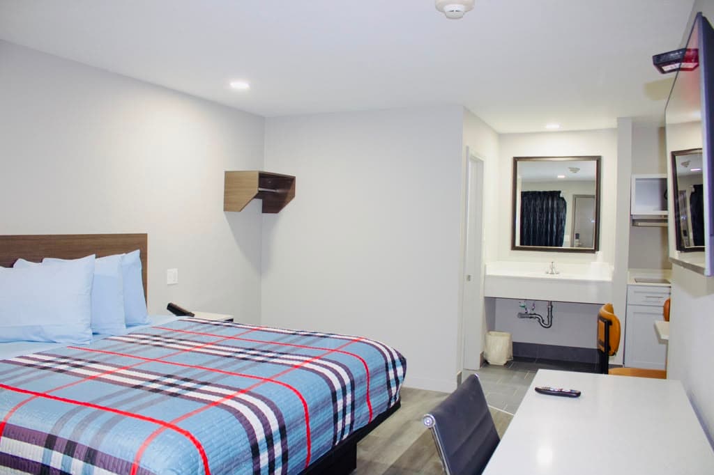Suite interior with the vanity and bathroom just off the bedroom