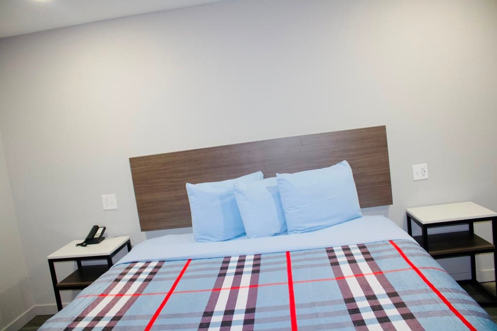 Queen bed flanked by two nightstands