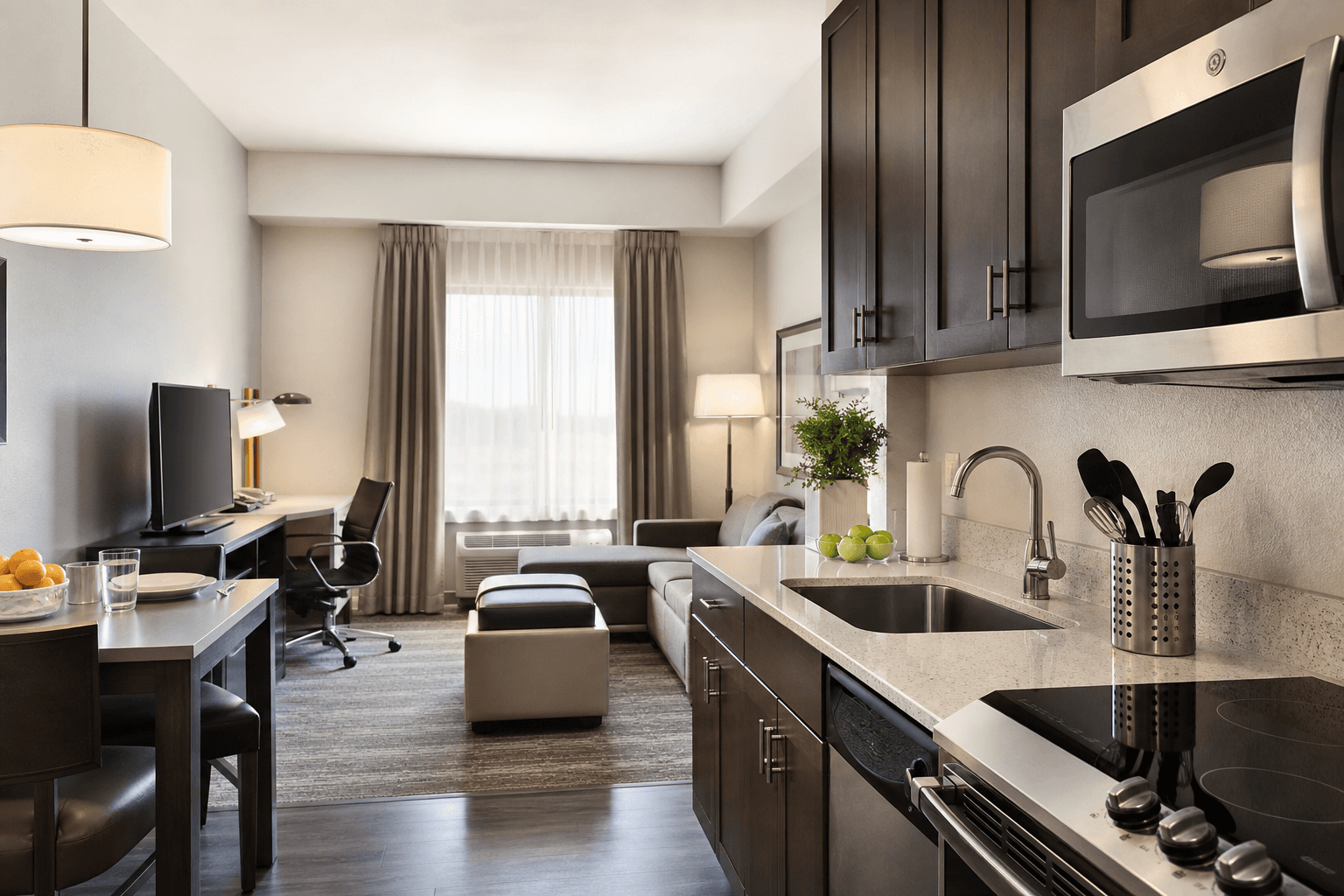 What should you check before booking monthly extended-stay suites with full kitchens Oklahoma City?